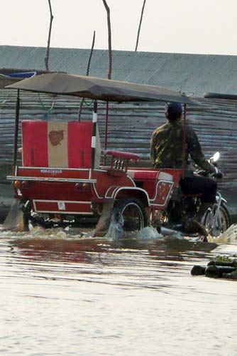 Is that sensible driving a bike through a river?